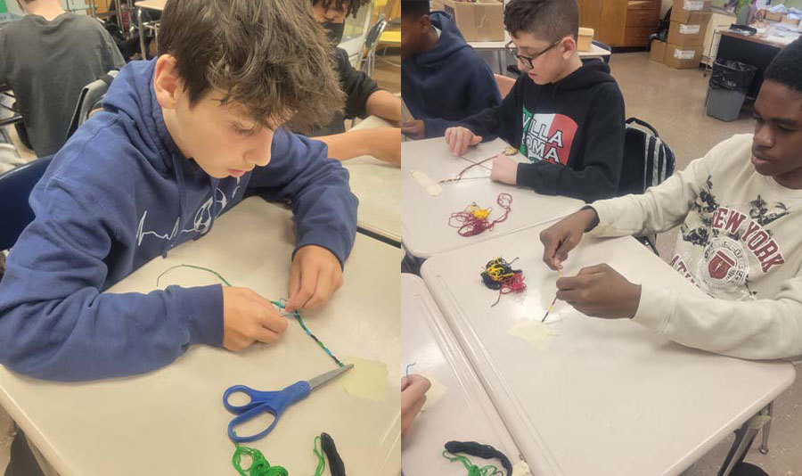 ​Seventh grade students making Friendship Bracelets