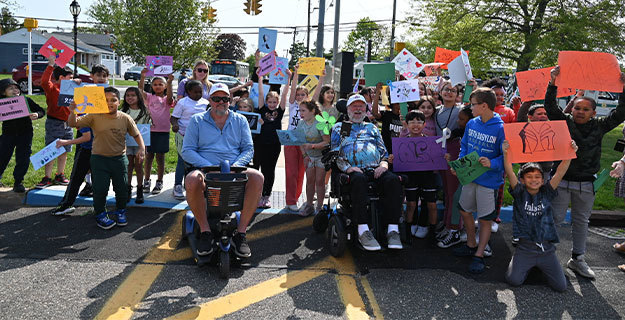 Members of the ALS Ride for Life organization with students