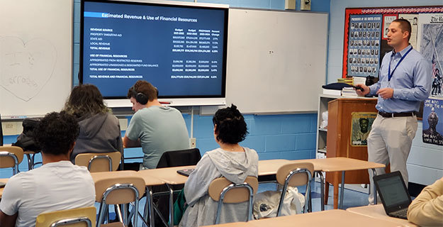 Assistant Superintendent for Business Frank Bacchi speaking to students