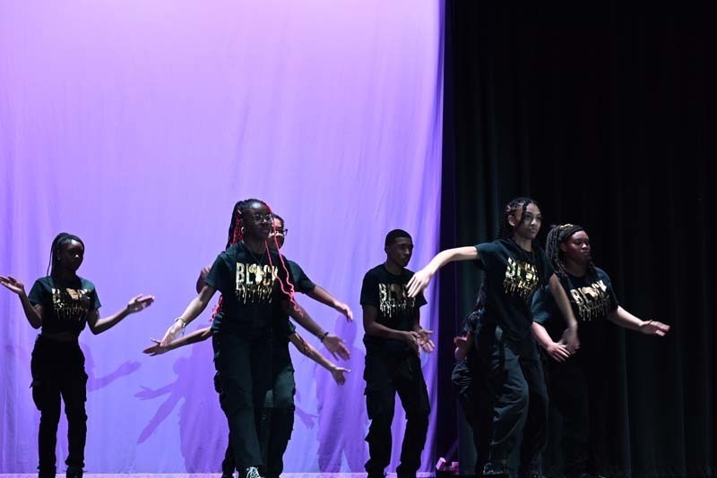 Students dancing on a stage