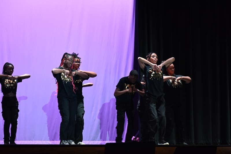 Students dancing on a stage