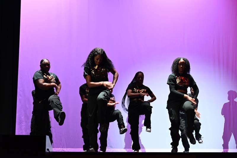 Students dancing on a stage