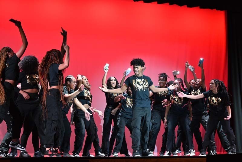 Students dancing on a stage