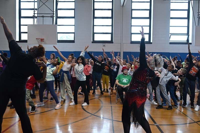 Students dancing with a member of the  Phyllis Rose Dance Company 